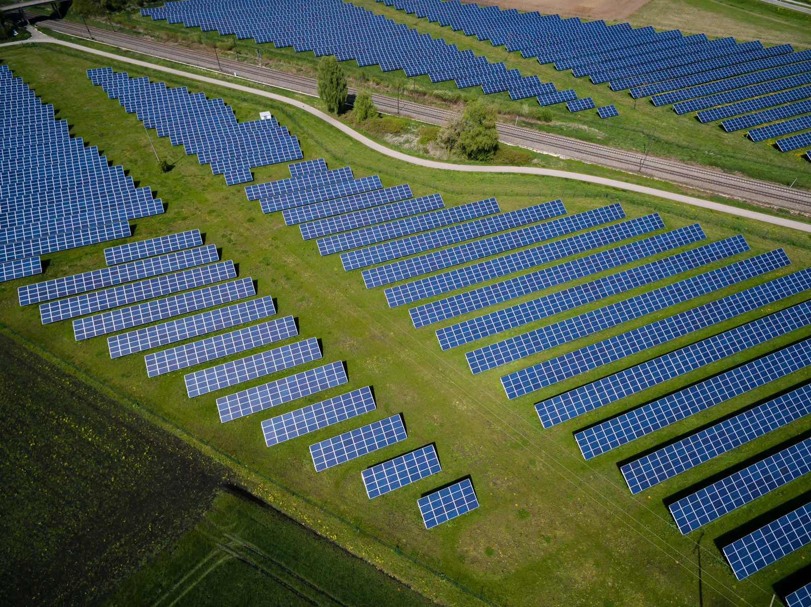 Aerial view of a utility-scale solar array feeding the grid